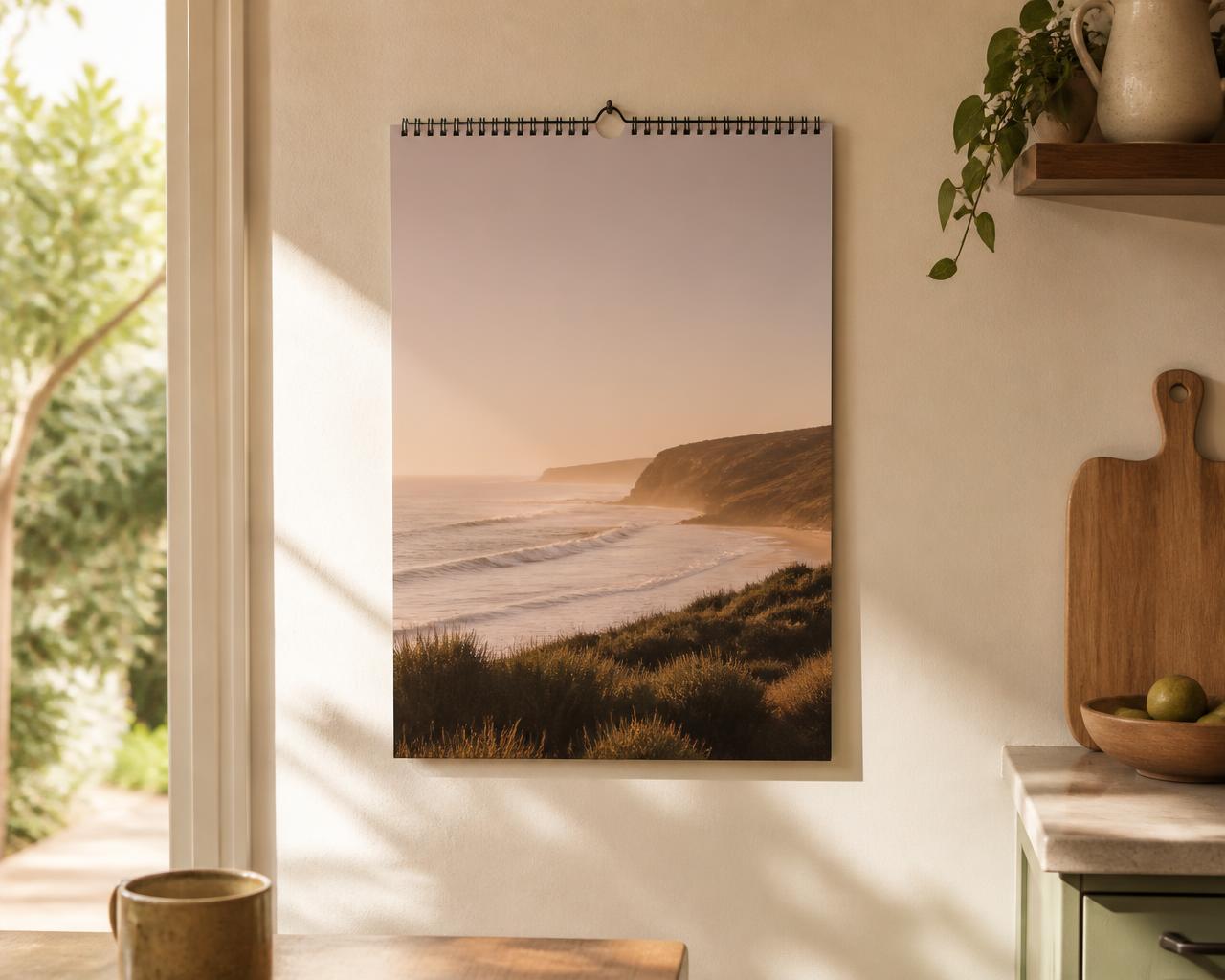 Printed 2027 wall calendar hanging in a sunlit kitchen